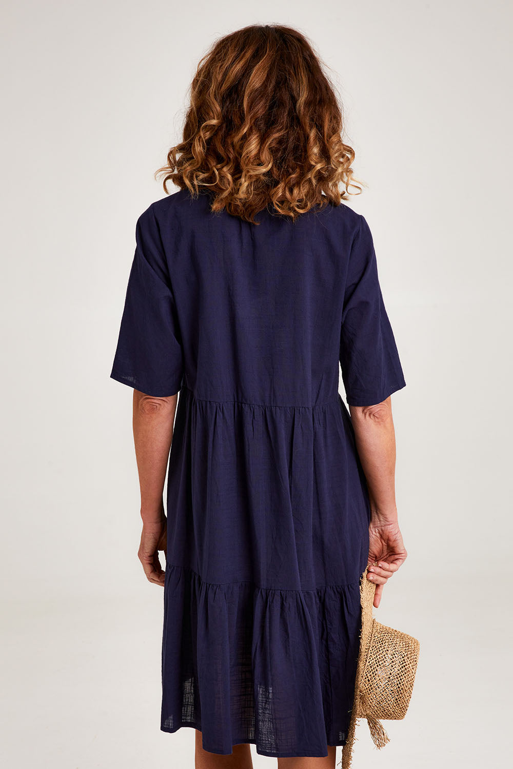 Model Emma wearing size 10 of the Essentials Organic Cotton Layers Slub Dress in colour Navy (Blue), from the back