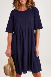 Model Emma wearing size 10 of the Essentials Organic Cotton Layers Slub Dress in colour Navy (Blue), from the front, cropped image