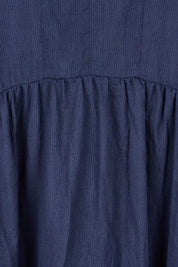 Product shot of the Essentials Organic Cotton Gauze Peak Dress in colour Navy (Blue), detail