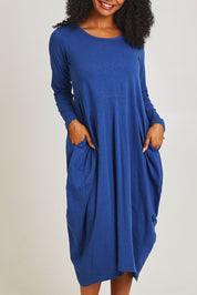 Model Ziara wearing size 10 of the Cotton Blend Bubble Dress in colour Blue (Blue), from the front, cropped image
