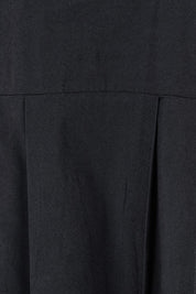 Product shot of the Essentials Pleated Cotton Dress in colour Black (Black), detail