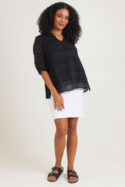 Model Ziara wearing size 10 of the Essentials Organic Cotton Pleated Top in colour Black (Black), from the front, showing the whole outfit