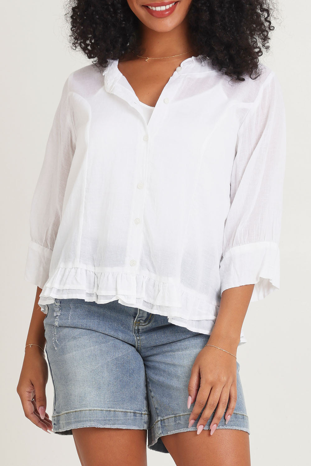 Model Ziara wearing size 10 of the Essentials Buttonthrough Cotton Top in colour White (White), from the front, cropped image