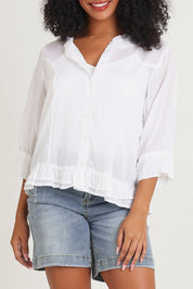 Model Ziara wearing size 10 of the Essentials Buttonthrough Cotton Top in colour White (White), from the front, cropped image
