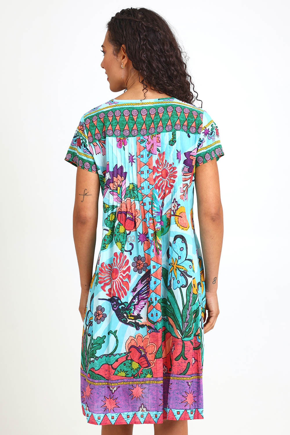 Model Pamelar wearing size 10 of the Essy Fit Dress – Print in colour Print, from the back