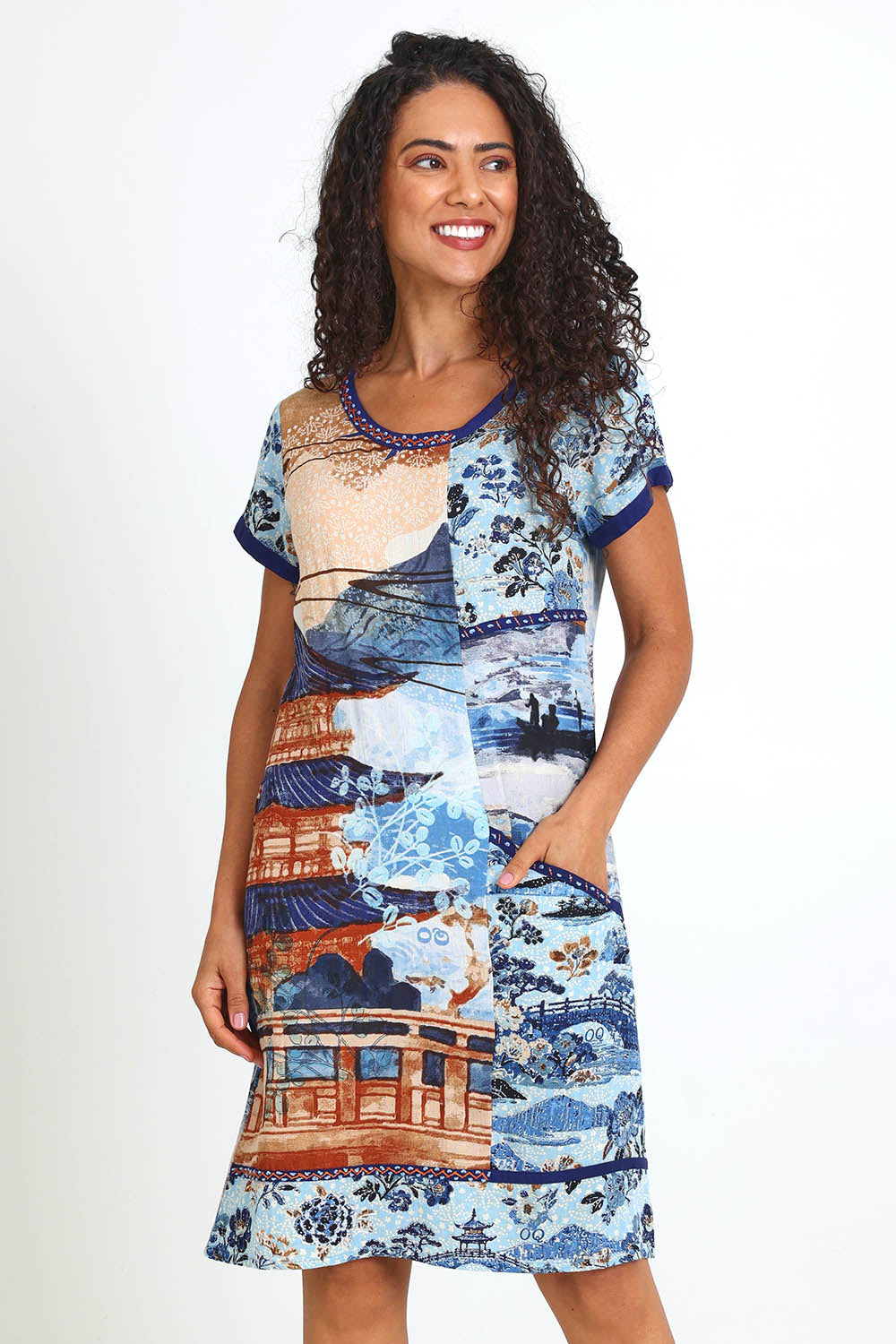 Model Pamelar wearing size 10 of the Patch Dress – Blue in colour Blue, in a cropped view