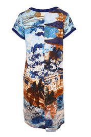 Product shot of the Patch Dress – Blue in colour Blue, from the back