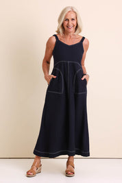 Model Sandys wearing size 10 of the Essentials Strappy Linen Blend Dress - Navy in colour Navy, from the front