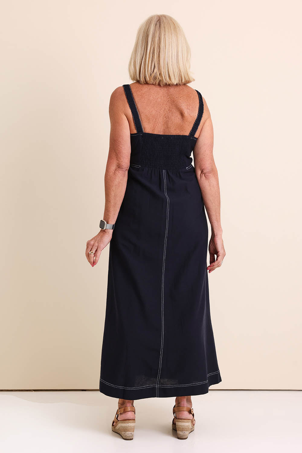 Model Sandys wearing size 10 of the Essentials Strappy Linen Blend Dress - Navy in colour Navy, from the front