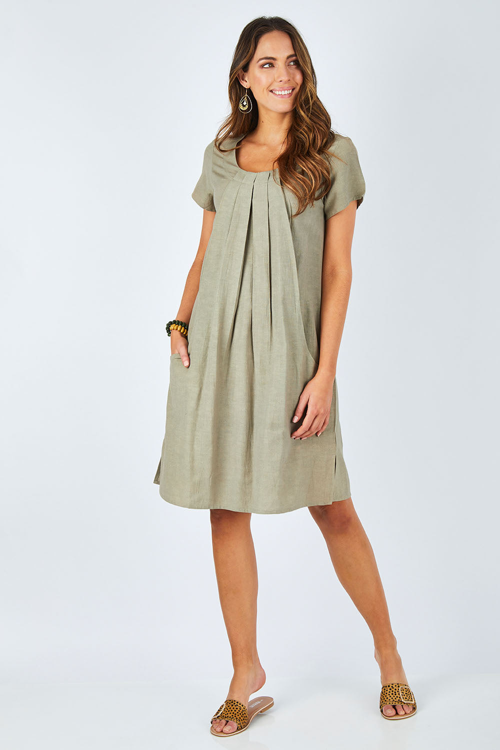 Model Madeline wearing size 10 of the Essential Sleeve Dress in colour Olive (Green), from the front, showing the whole outfit