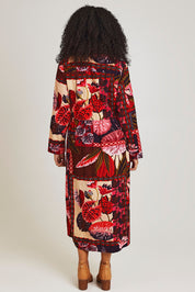 Model Ziara wearing size 10 of the Chandalier Cord Long Collar Dress in colour Chandalier (Red), from the back