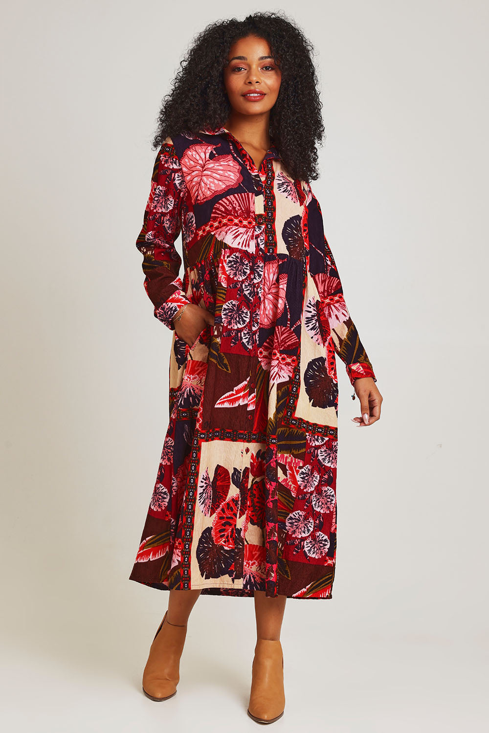 Model Ziara wearing size 10 of the Chandalier Cord Long Collar Dress in colour Chandalier (Red), from the front, showing the whole outfit