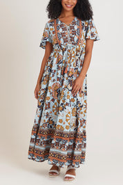 Model Ziara wearing size 10 of the Layers Maxi Dress in colour Macieo, from the front, cropped image