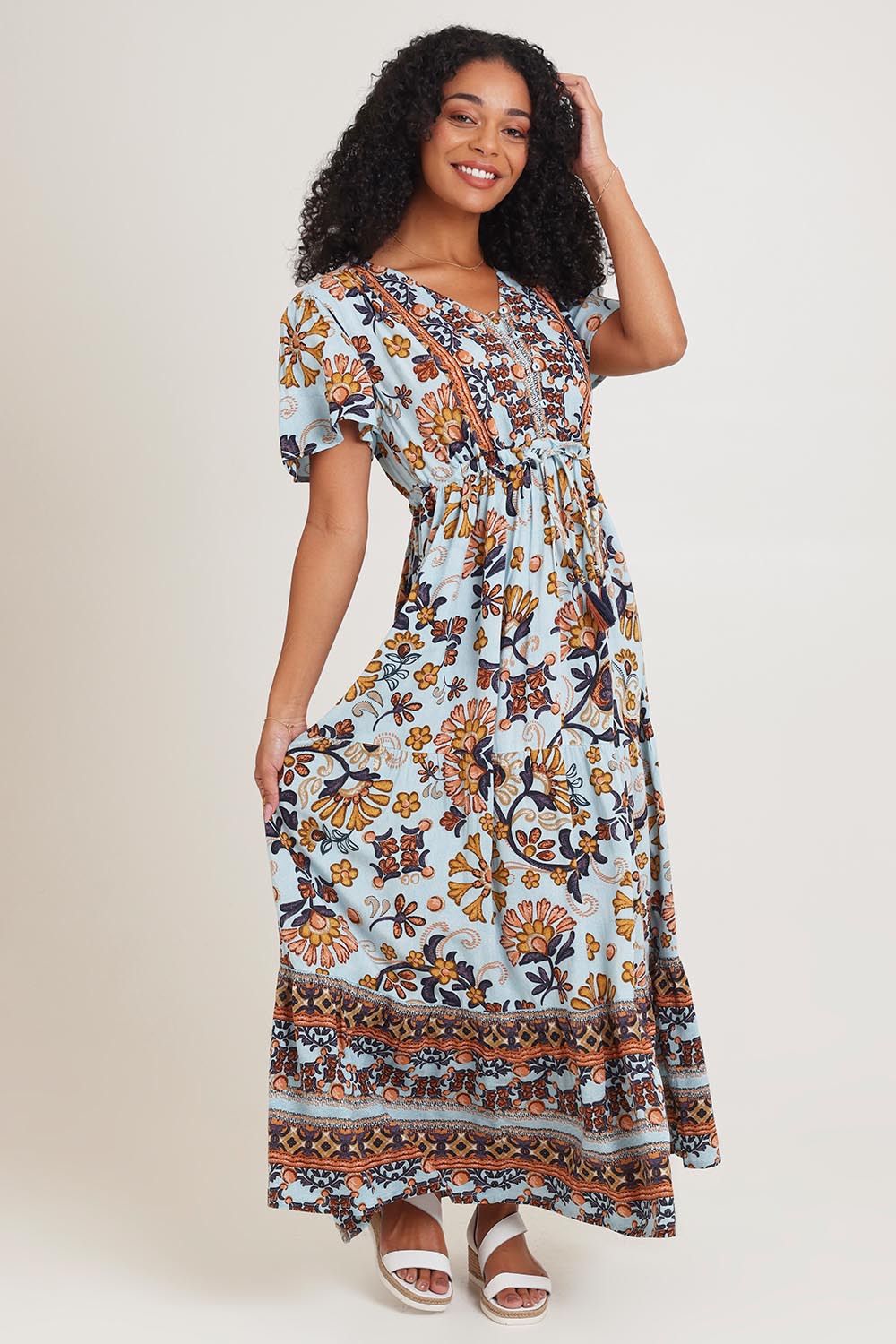 Model Ziara wearing size 10 of the Layers Maxi Dress in colour Macieo, from the front, showing the whole outfit