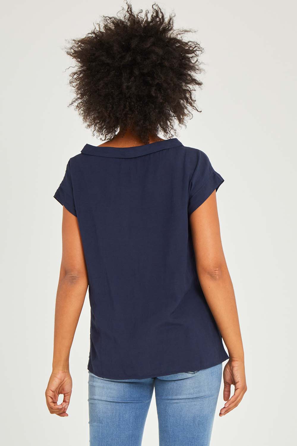 Model Olivia wearing size 10 of the Essentials Linen Blend Folded Neckline Top in colour Navy (Blue), from the back