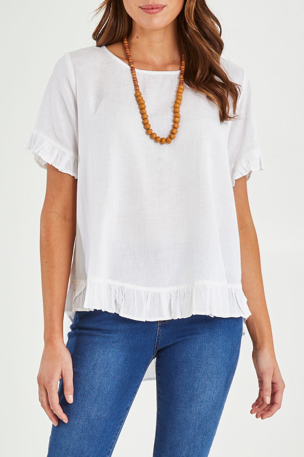 Model Madeline wearing size 10 of the Essentials Linen Blend Frill Top in colour White (White), from the front, cropped image