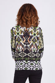 Model Emma wearing size 10 of the Izmir Pleated Boho Top in colour Green (Green), from the back