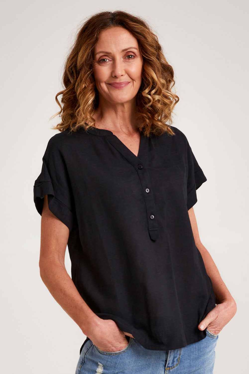 Model Emma wearing size 10 of the Essentials Linen Blend Manderin Collar Top in colour Black (Black), from the front, cropped image