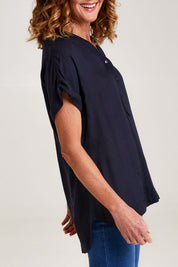 Model Emma wearing size 10 of the Essentials Linen Blend Manderin Collar Top in colour Navy (Blue), from the front, cropped image