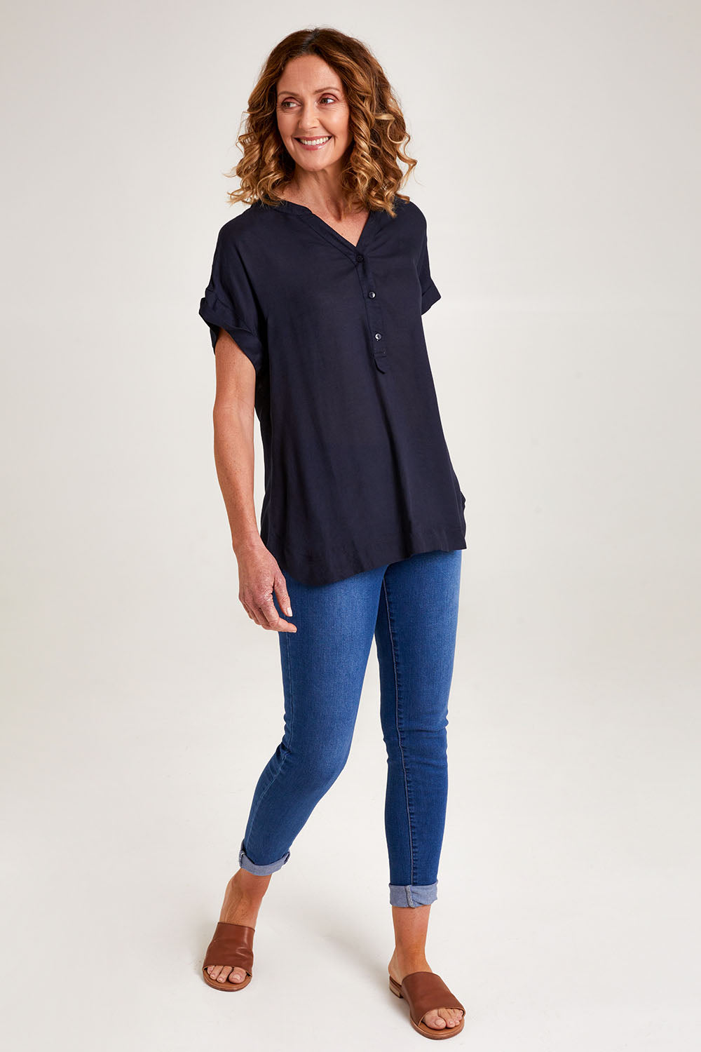 Model Emma wearing size 10 of the Essentials Linen Blend Manderin Collar Top in colour Navy (Blue), from the front, showing the whole outfit
