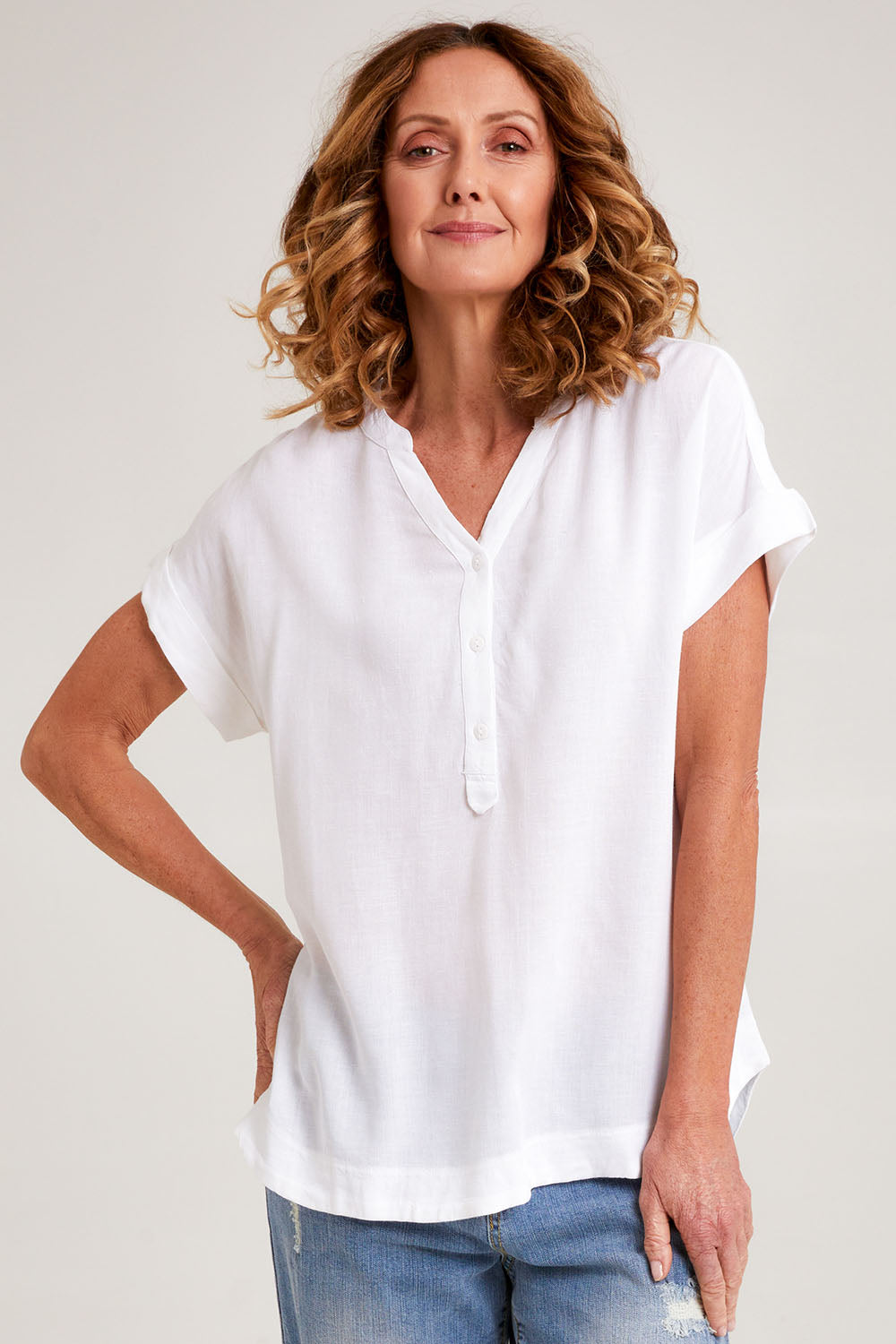 Model Emma wearing size 10 of the Essentials Linen Blend Manderin Collar Top in colour White (White), from the front, cropped image