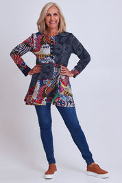 Model Sandy wearing size 10 of the Hotel California Patch Tunic Top in colour California (Blue), from the front, showing the whole outfit