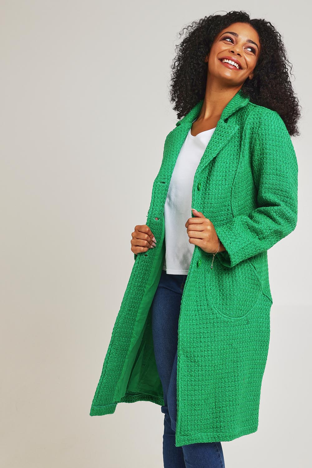 Model Ziara wearing size 10 of the Solid Cotton Long Coat in colour Green (Green), from the front, cropped image