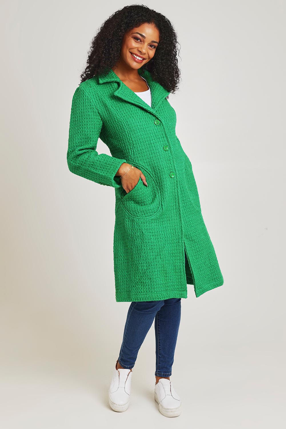 Model Ziara wearing size 10 of the Solid Cotton Long Coat in colour Green (Green), from the front, showing the whole outfit
