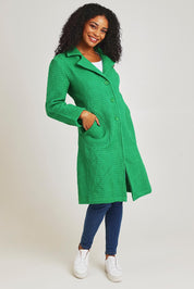 Model Ziara wearing size 10 of the Solid Cotton Long Coat in colour Green (Green), from the front, showing the whole outfit