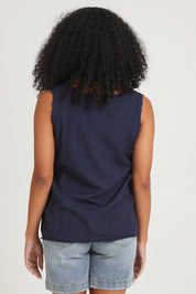 Model Ziara wearing size 10 of the Essentials Linen Blend Frill Top in colour Navy (Blue), from the back