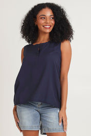 Model Ziara wearing size 10 of the Essentials Linen Blend Frill Top in colour Navy (Blue), from the front, cropped image