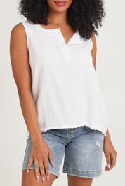 Model Ziara wearing size 10 of the Essentials Linen Blend Frill Top in colour White (White), from the front, cropped image