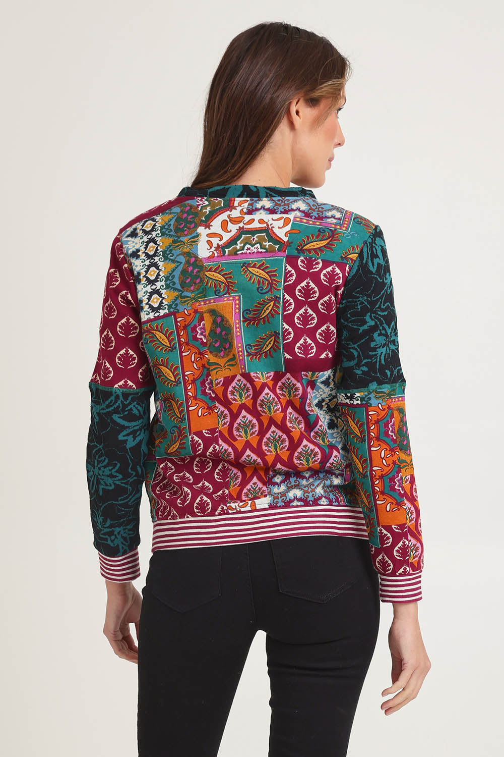 Model Madeline wearing size 10 of the Patch Cardigan in colour Prato, from the back