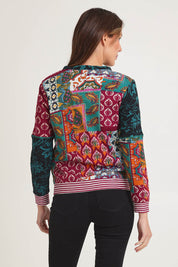 Model Madeline wearing size 10 of the Patch Cardigan in colour Prato, from the back