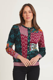 Model Madeline wearing size 10 of the Patch Cardigan in colour Prato, from the front, cropped image