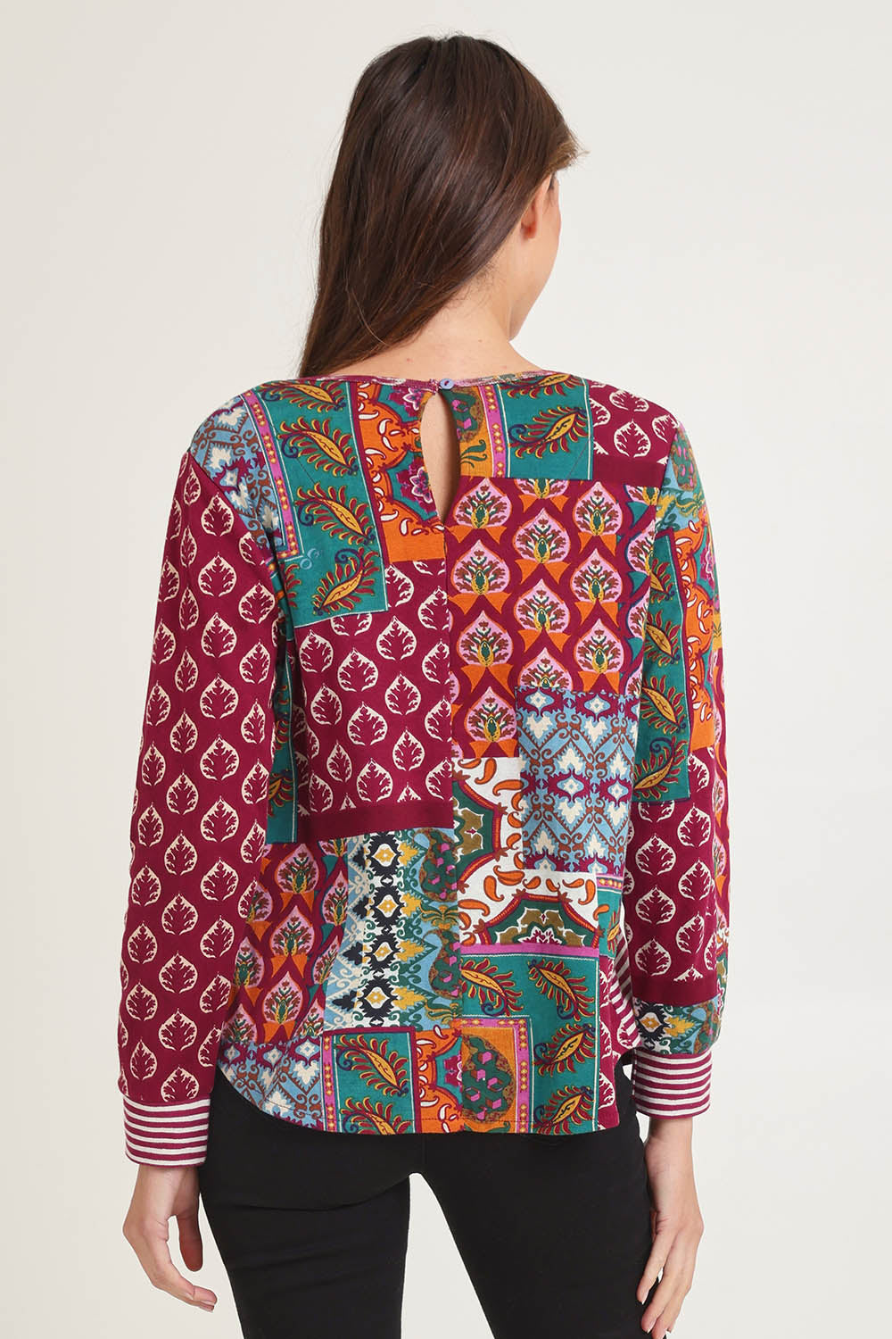 Model Madeline wearing size 10 of the Patch Top in colour Prato, from the back