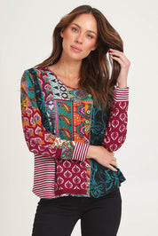 Model Madeline wearing size 10 of the Patch Top in colour Prato, from the front, cropped image