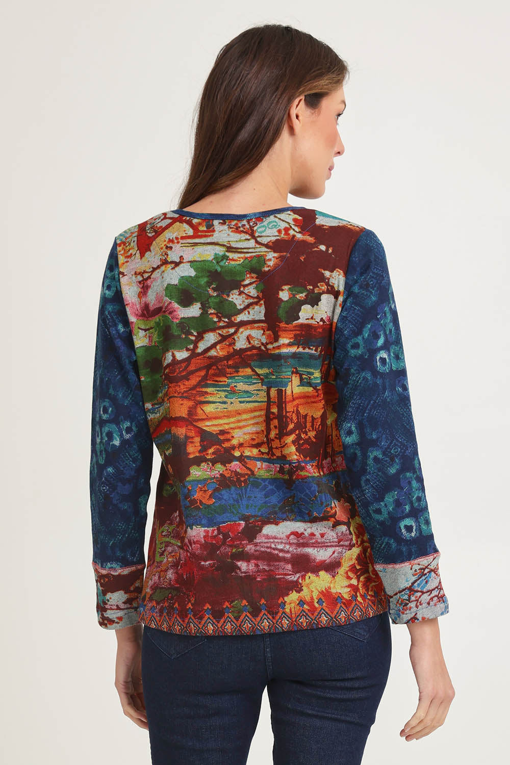 Model Madeline wearing size 10 of the Patch Top in colour Nippori (Blue), from the back
