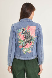 Model Madeline wearing size 10 of the Denim Jacket in colour Keqioa (Blue), from the back