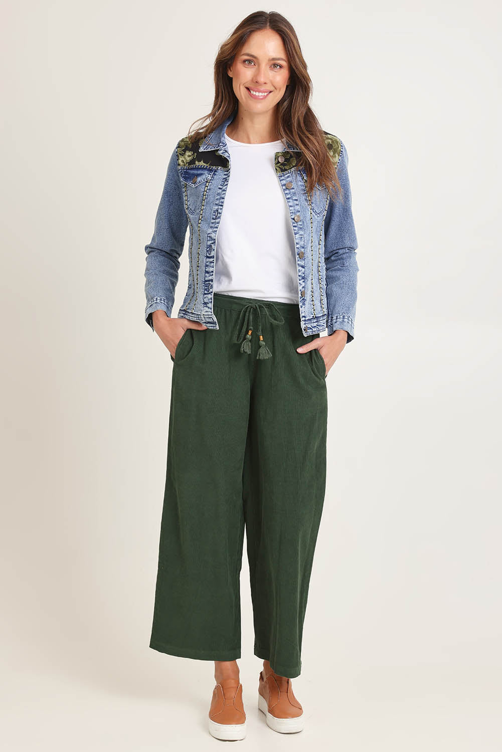 Model Madeline wearing size 10 of the Denim Jacket in colour Keqioa (Blue), from the front, showing the whole outfit