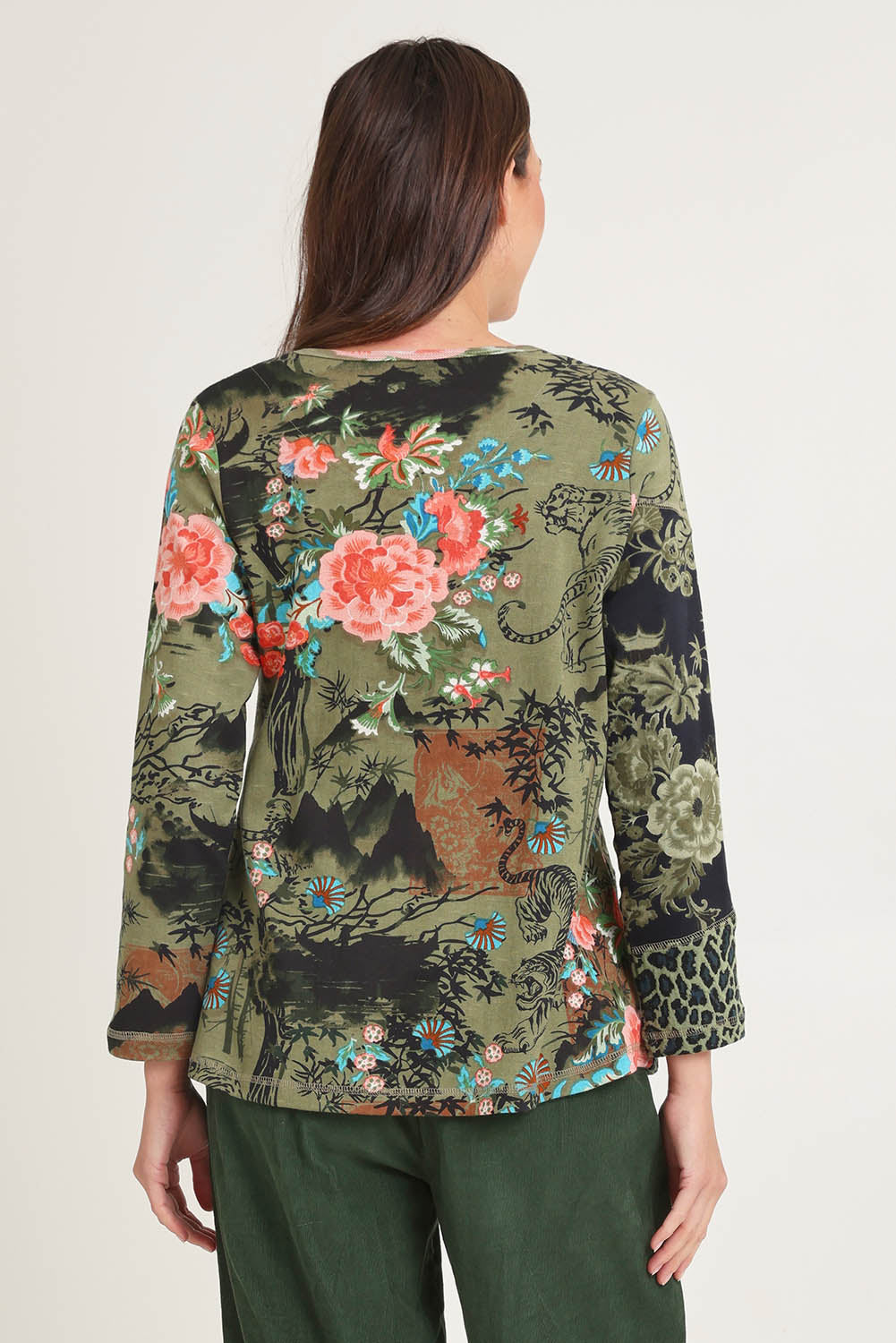 Model Madeline wearing size 10 of the Patch Top in colour Keqioa (Green), from the back