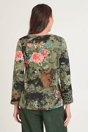 Model Madeline wearing size 10 of the Patch Top in colour Keqioa (Green), from the back