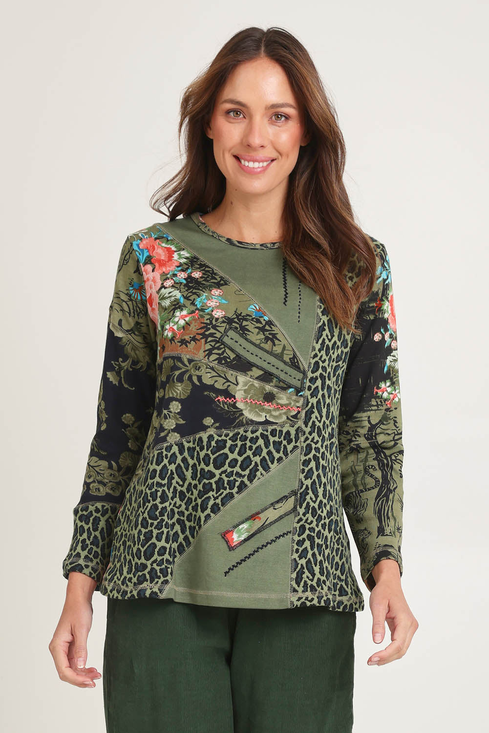 Model Madeline wearing size 10 of the Patch Top in colour Keqioa (Green), from the front, cropped image