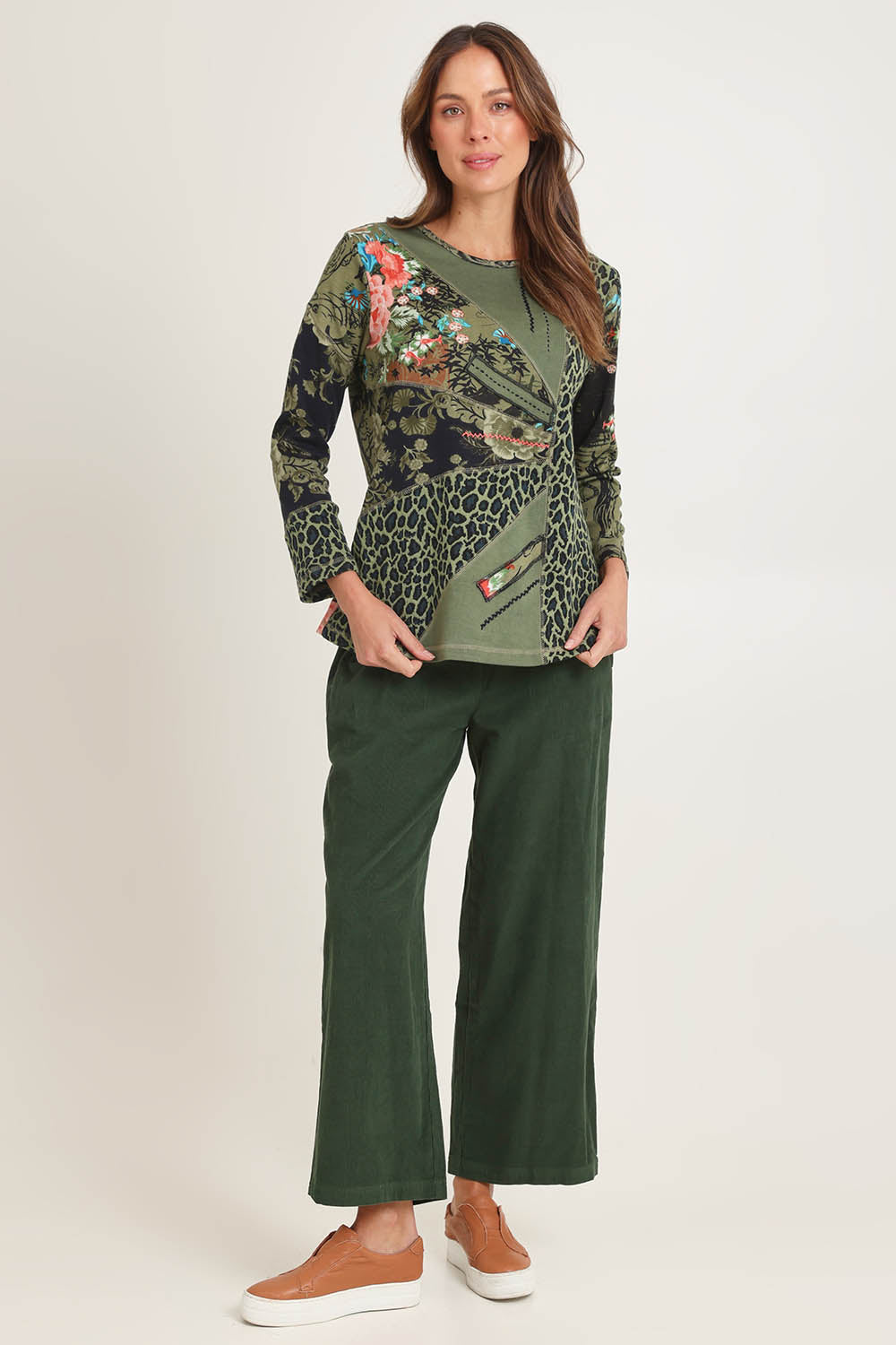 Model Madeline wearing size 10 of the Patch Top in colour Keqioa (Green), from the front, showing the whole outfit