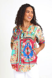 Model Pamelar wearing size 10 of the Pleated Top – Print in colour Print, in a cropped view