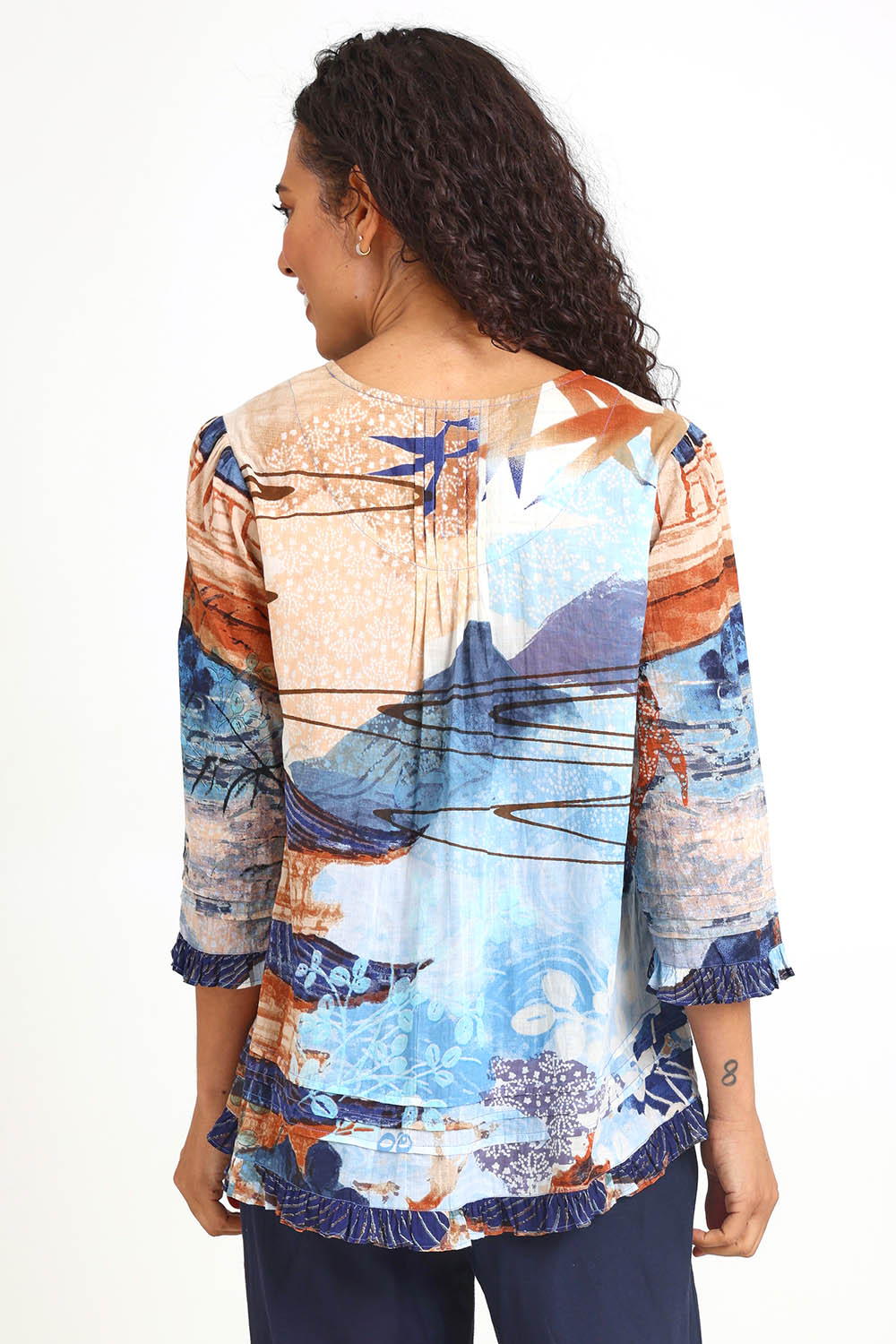 Model Pamelar wearing size 10 of the Pleated Top – Print in colour Print, from the back