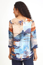 Model Pamelar wearing size 10 of the Pleated Top – Print in colour Print, from the back