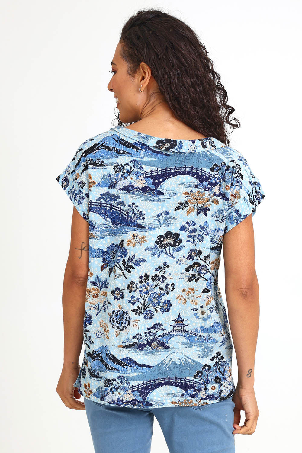 Model Pamelar wearing size 10 of the Rolled Neckline Top – Print in colour Print, from the back