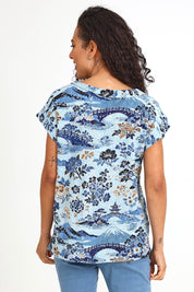 Model Pamelar wearing size 10 of the Rolled Neckline Top – Print in colour Print, from the back