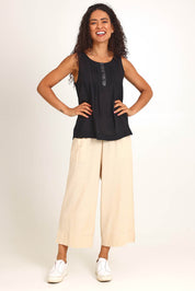 Model Pamelar wearing size 10 of the Essentials Linen Blend Cami - Black in colour Black, from the front
